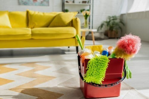 Bright Las Vegas living room with professional cleaning supplies ready for a residential cleaning service
