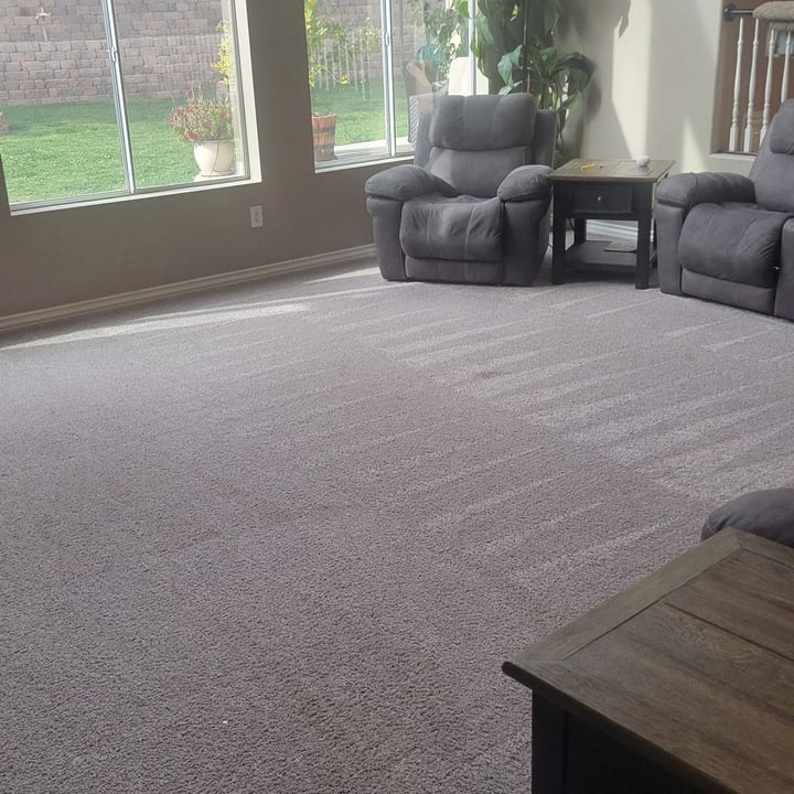 Living room carpet vacuumed wall to wall after a regular house cleaning